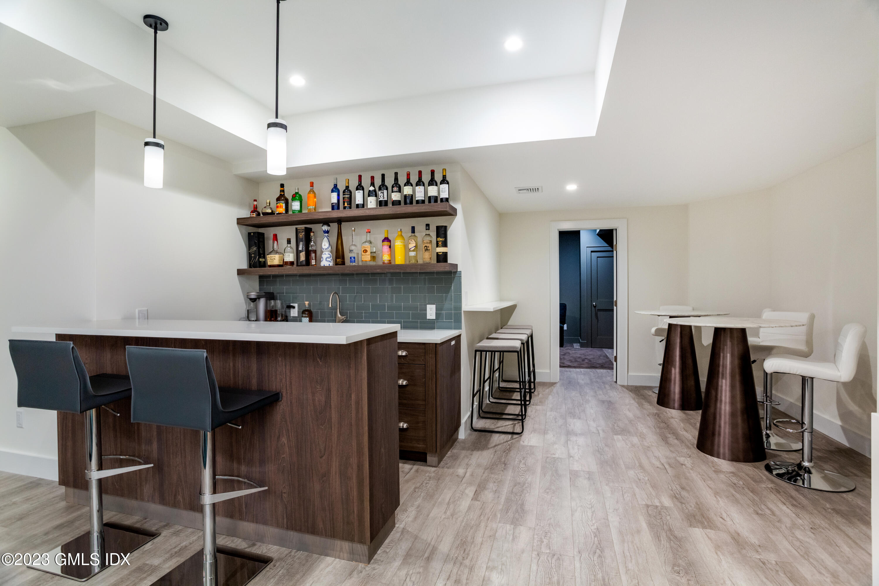 9 Cottontail Road Cos Cob, CT 06807 - Photo 24 of 33 a kitchen with stainless steel appliances granite countertop a sink a stove and a wooden floors