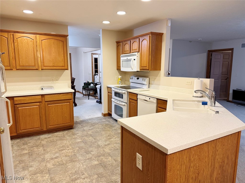 3718 Babcock Road Williamsfield, OH 44093 - Photo 20 of 31 Kitchen with sink, white appliances, and kitchen peninsula