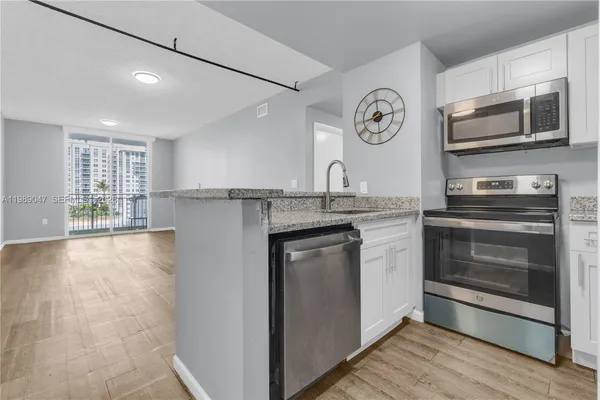 a kitchen with a stove oven and a refrigerator