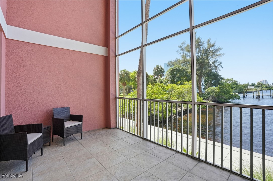 2743 First Street, Unit 109 Fort Myers, FL 33916 - Photo 25 of 27 a view of a chair and table in the balcony