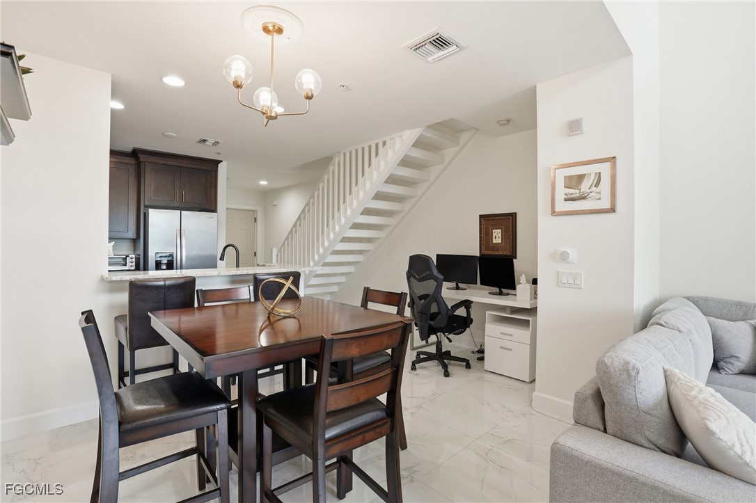 2743 First Street, Unit 109 Fort Myers, FL 33916 - Photo 9 of 27 a view of a dining room with furniture