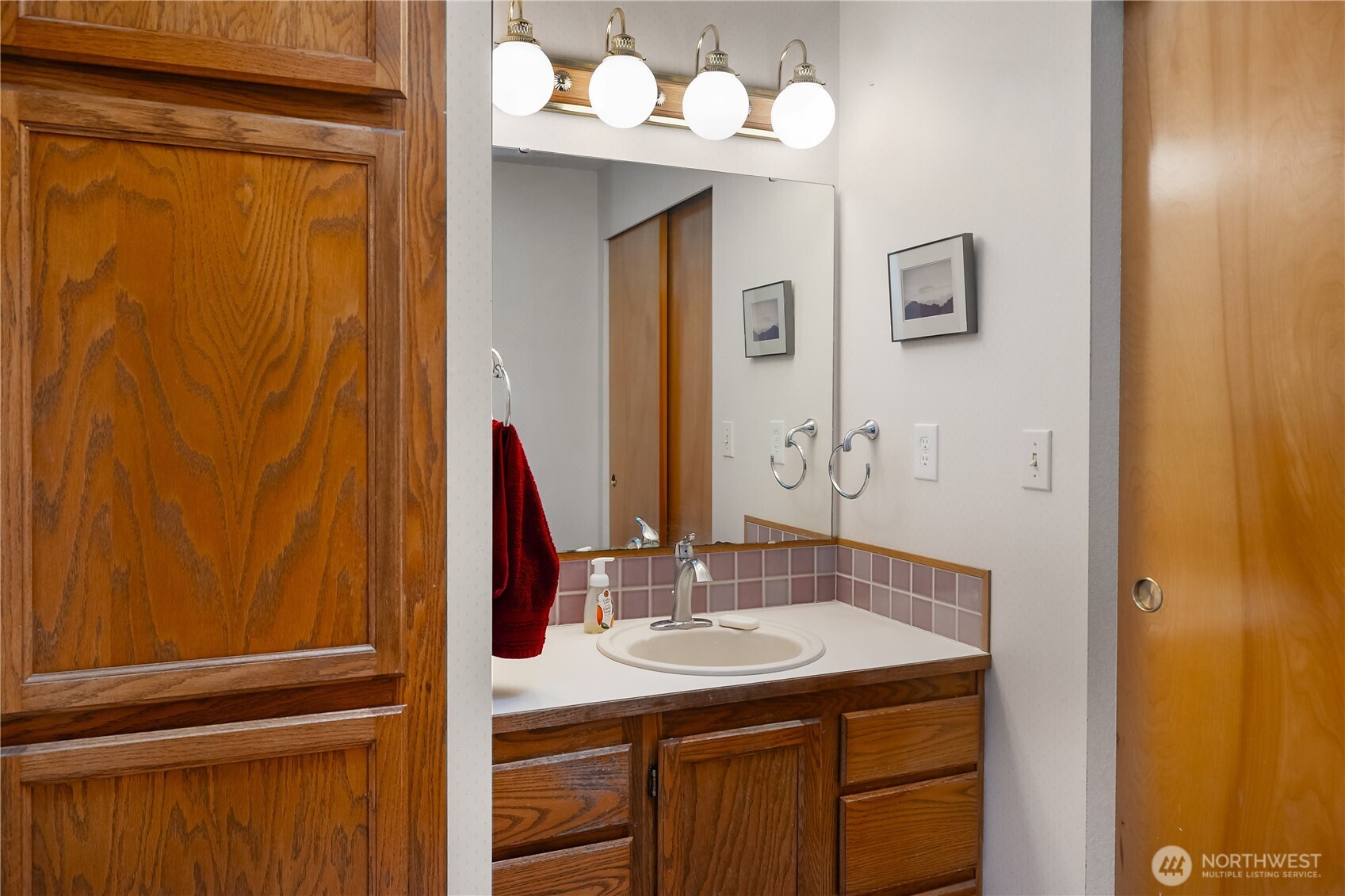 5505 Oyster Bay Road Northwest Olympia, WA 98502 - Photo 15 of 40 a bathroom with a sink and a mirror