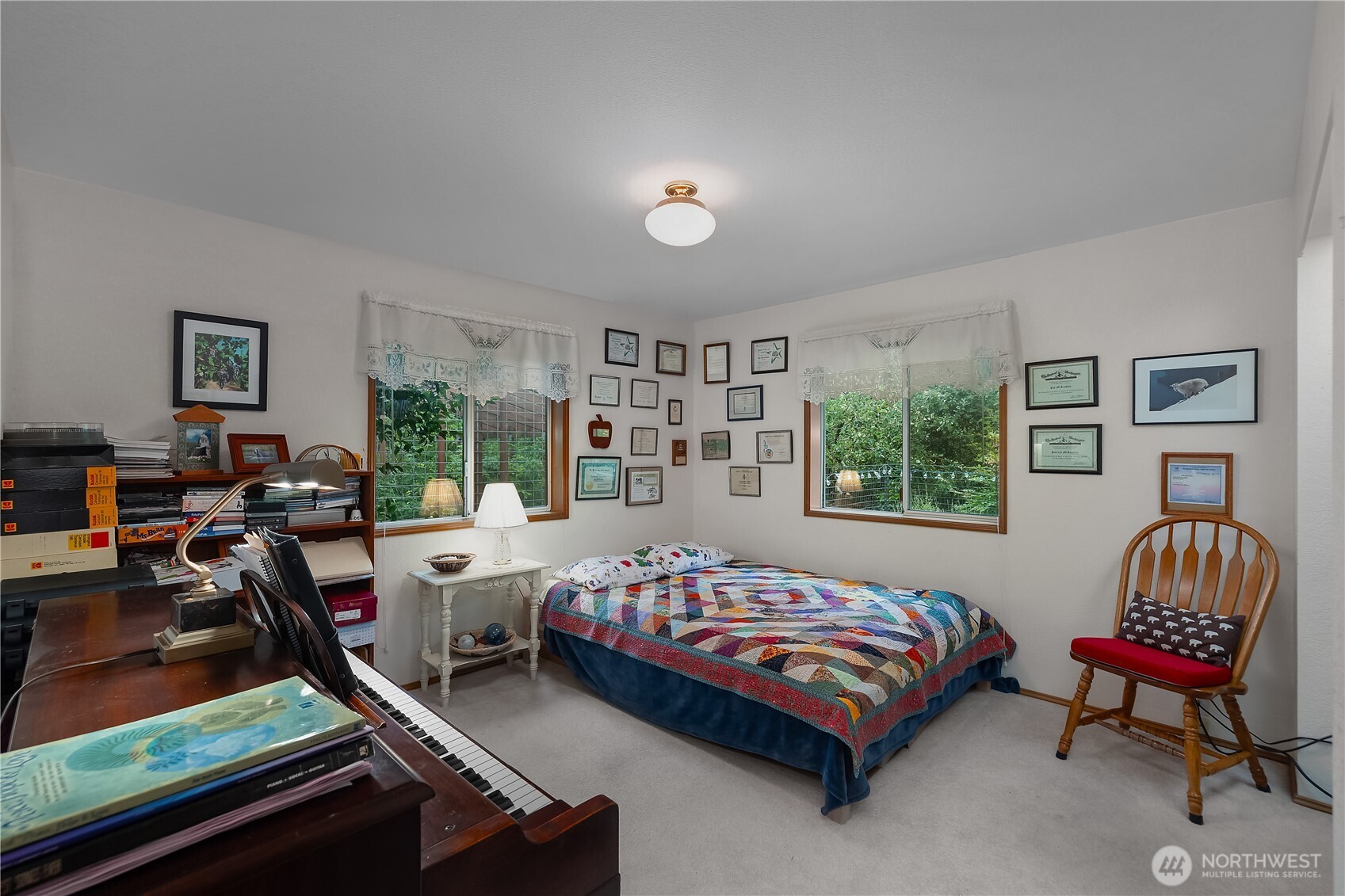 5505 Oyster Bay Road Northwest Olympia, WA 98502 - Photo 19 of 40 a bedroom with a bed chair and window