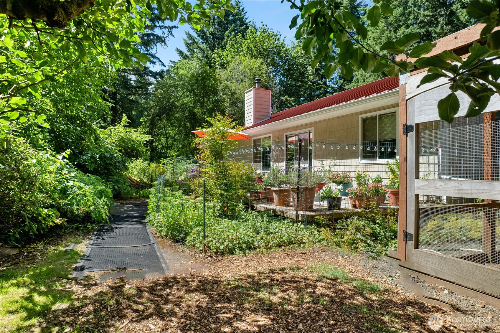 5505 Oyster Bay Road Northwest Olympia, WA 98502 - Photo 30 of 40 a front view of a house with garden