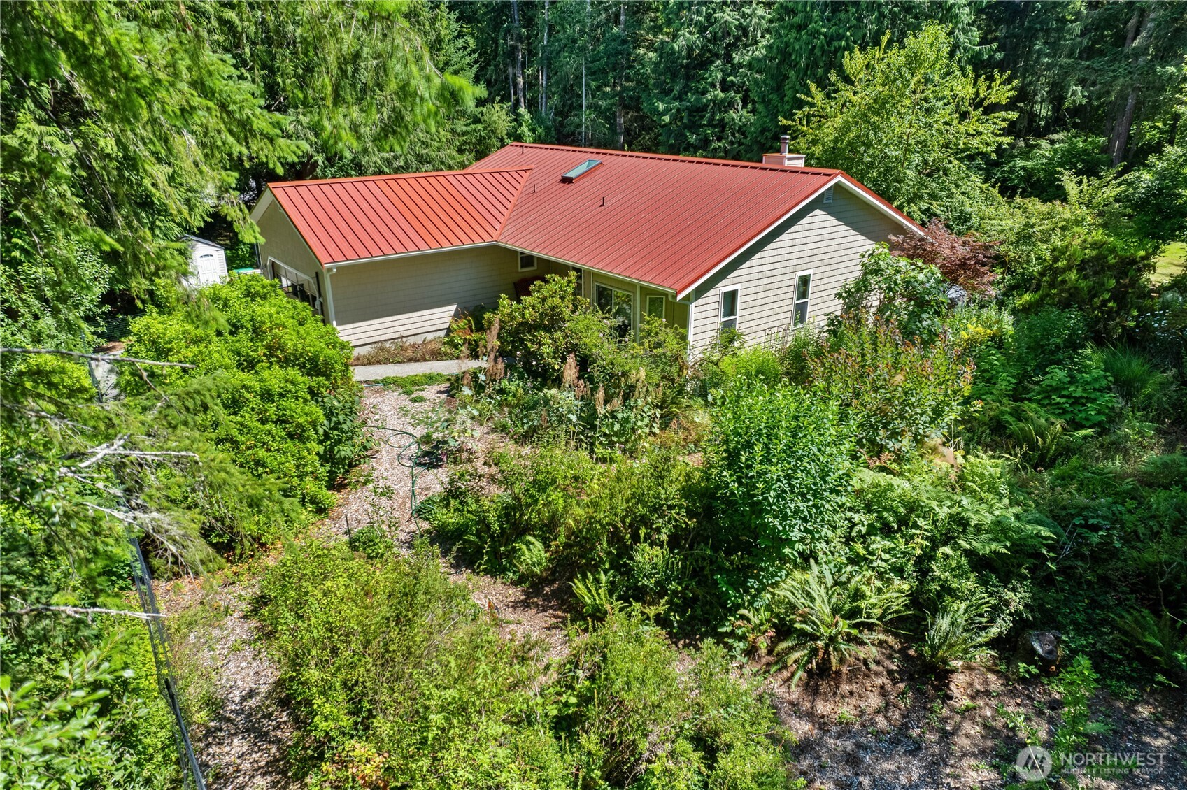 5505 Oyster Bay Road Northwest Olympia, WA 98502 - Photo 37 of 40 a view of a house with a yard