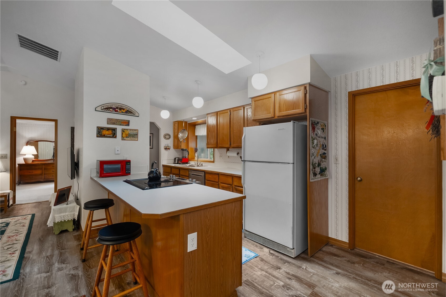 5505 Oyster Bay Road Northwest Olympia, WA 98502 - Photo 9 of 40 a kitchen with stainless steel appliances granite countertop a refrigerator and a stove top oven