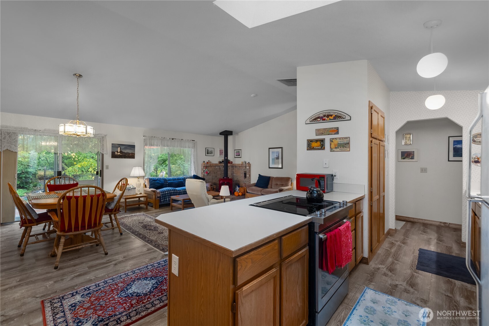 5505 Oyster Bay Road Northwest Olympia, WA 98502 - Photo 10 of 40 a kitchen that has a table and chairs in it