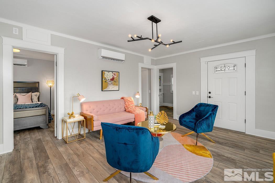 215 East Liberty Street Reno, NV 89501 - Photo 6 of 20 a living room with furniture and a chandelier