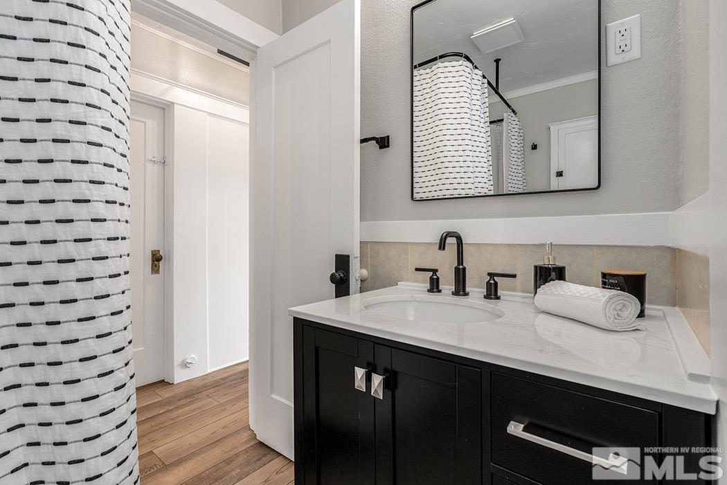 215 East Liberty Street Reno, NV 89501 - Photo 10 of 20 a bathroom with a double vanity sink mirror and
