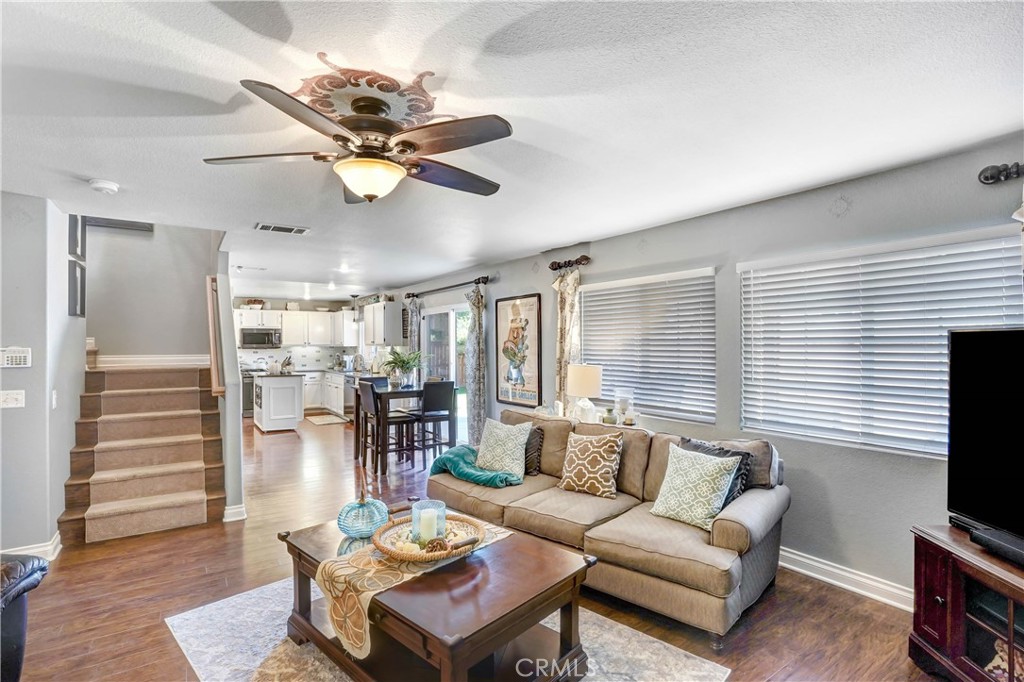 42005 Pine Needle Street Temecula, CA 92591 - Photo 13 of 45 Family Room leads to kitchen as staged by previous tenant.