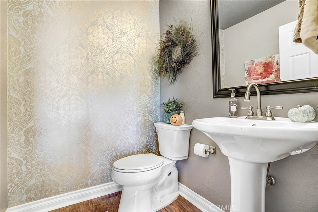 42005 Pine Needle Street Temecula, CA 92591 - Photo 14 of 45 The powder bath is downstairs conveniently located between kitchen and family room.