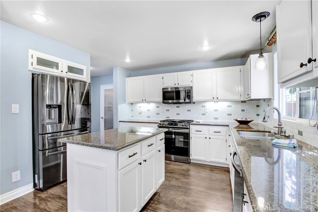 42005 Pine Needle Street Temecula, CA 92591 - Photo 16 of 45 Appliances included include refrigerator, gas & electric cooktop, microwave w/exhaust hood & dishwasher.