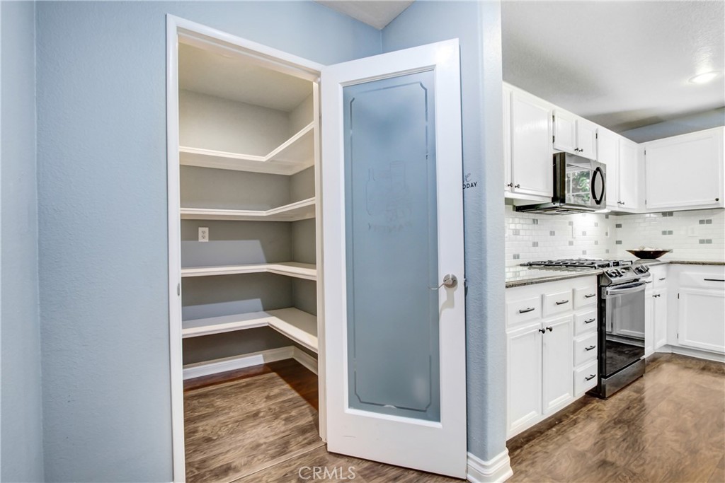 42005 Pine Needle Street Temecula, CA 92591 - Photo 17 of 45 There is a large walk-in pantry just off the attached garage for after shopping storage.