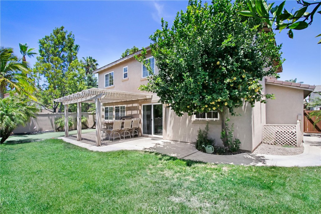 42005 Pine Needle Street Temecula, CA 92591 - Photo 20 of 45 There is a grassy area for pets and play, as well as a large lemon and orange tree.