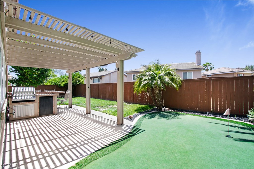 42005 Pine Needle Street Temecula, CA 92591 - Photo 22 of 45 The covered outdoor BBQ area has seating for 4, chairs included.