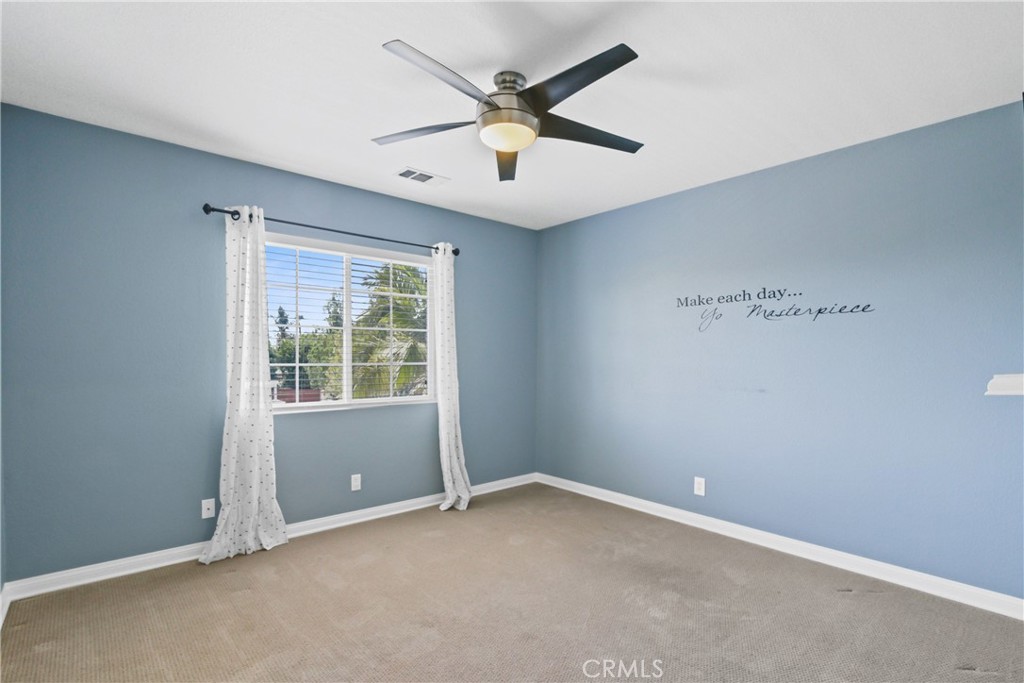 42005 Pine Needle Street Temecula, CA 92591 - Photo 31 of 45 Bedroom #2 which has a walk-in closet.