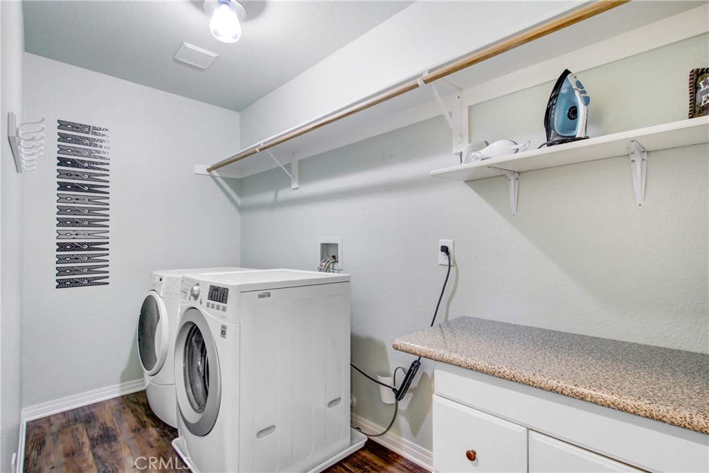 42005 Pine Needle Street Temecula, CA 92591 - Photo 39 of 45 The upstairs laundry with included washer and dryer.