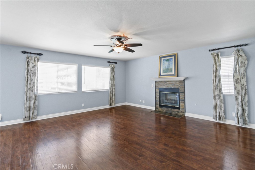 42005 Pine Needle Street Temecula, CA 92591 - Photo 9 of 45 The focal point of the family room is the gas fireplace.