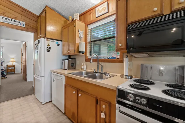 a kitchen with a stove and a refrigerator