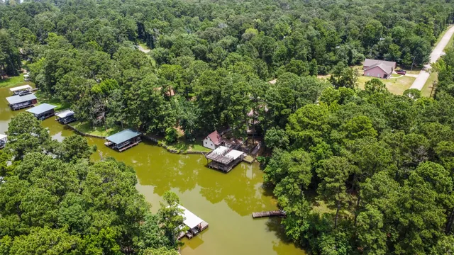 a view of a lake with houses in the background