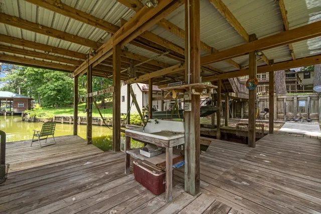 a wooden deck with sunset view
