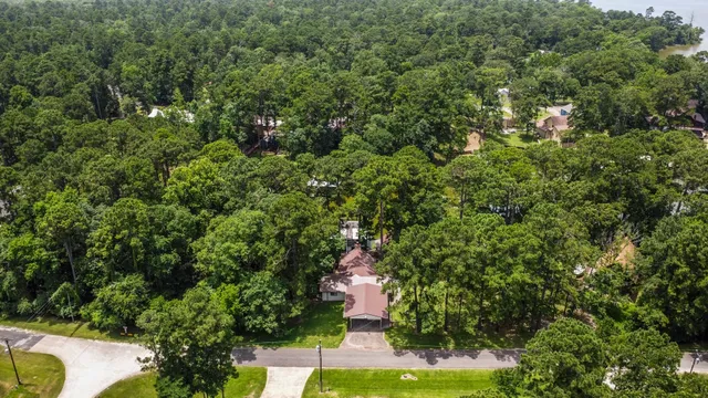 a view of a house with backyard porch and sitting area