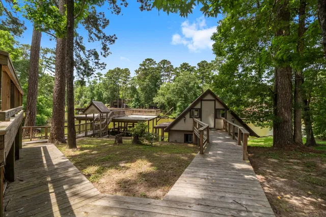 a view of a patio with table and chairs under an umbrella