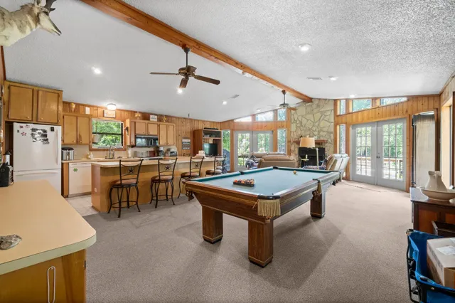 a room with lots of furniture and windows