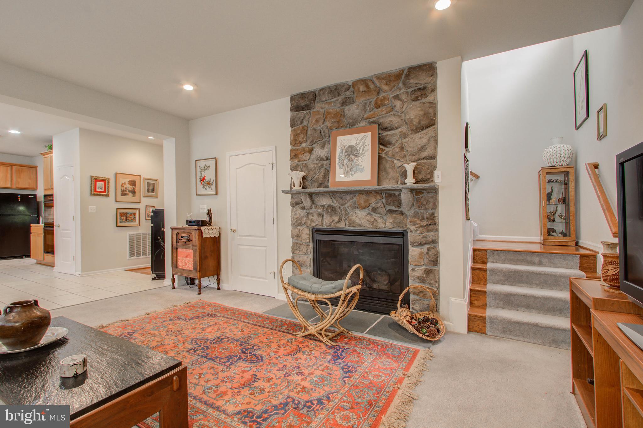 22 Rivers Edge Terrace Indian Head, MD 20640 - Photo 22 of 44 Fireplace with Stone Boarder Wall