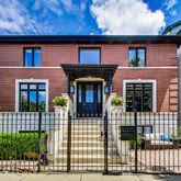 a front view of a house with glass windows