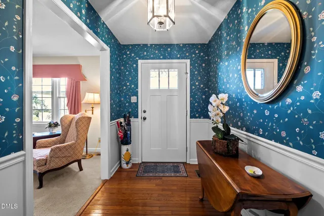 an aerial view of residential house with outdoor space and trees