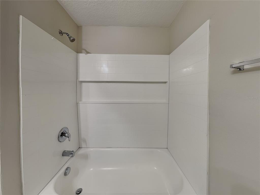 Undisclosed Address Spring Hill, FL 34608 - Photo 16 of 17 a bathroom with a bathtub
