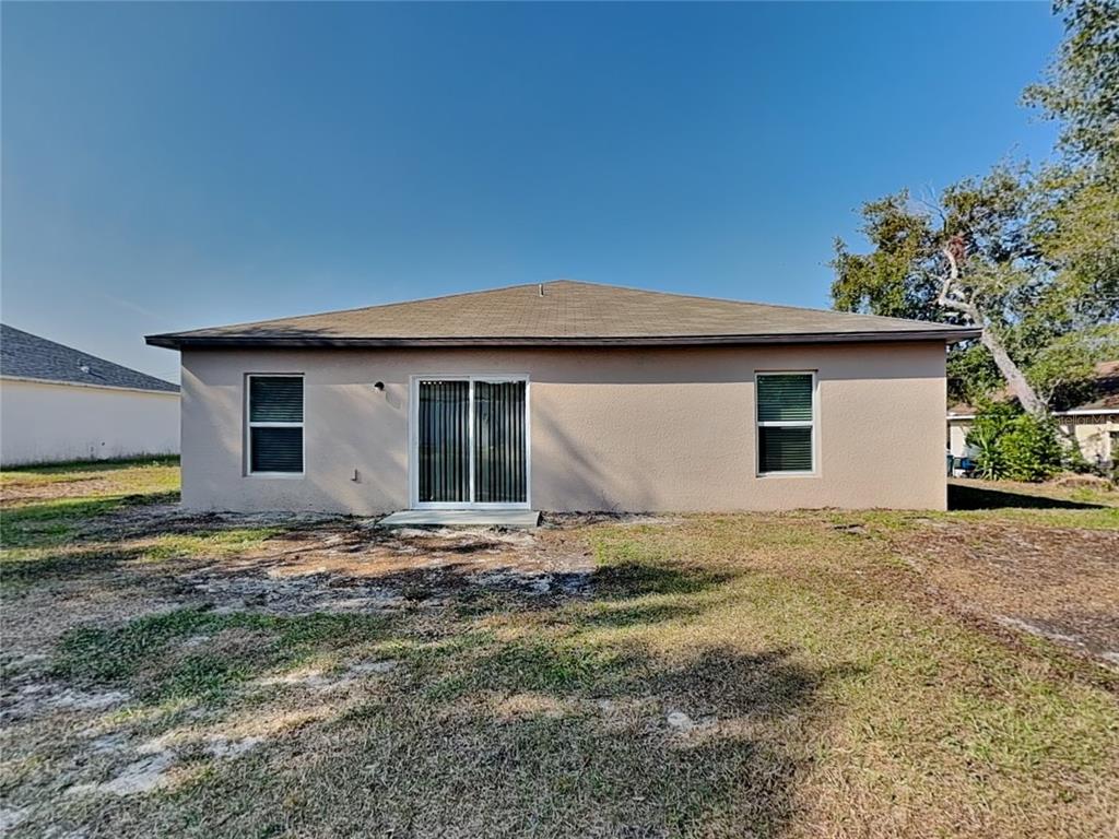 Undisclosed Address Spring Hill, FL 34608 - Photo 17 of 17 a backyard of a house