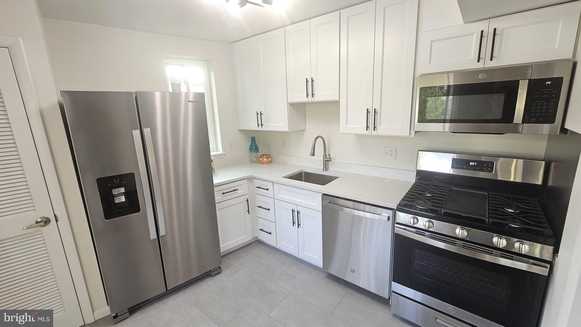 2515 Baltimore Road, Unit 25155 Rockville, MD 20853 - Photo 10 of 25 Quartz countertops with stainless steel appliances
