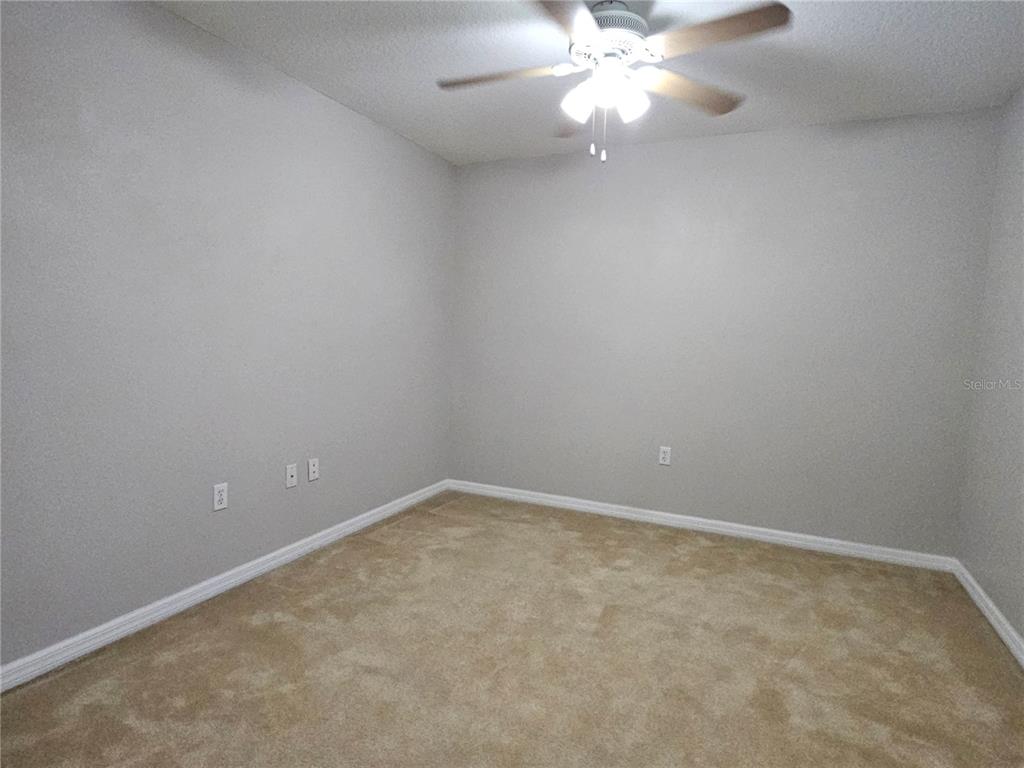 5383 Quarry Rock Road Lakeland, FL 33809 - Photo 17 of 23 a view of an empty room with a fan