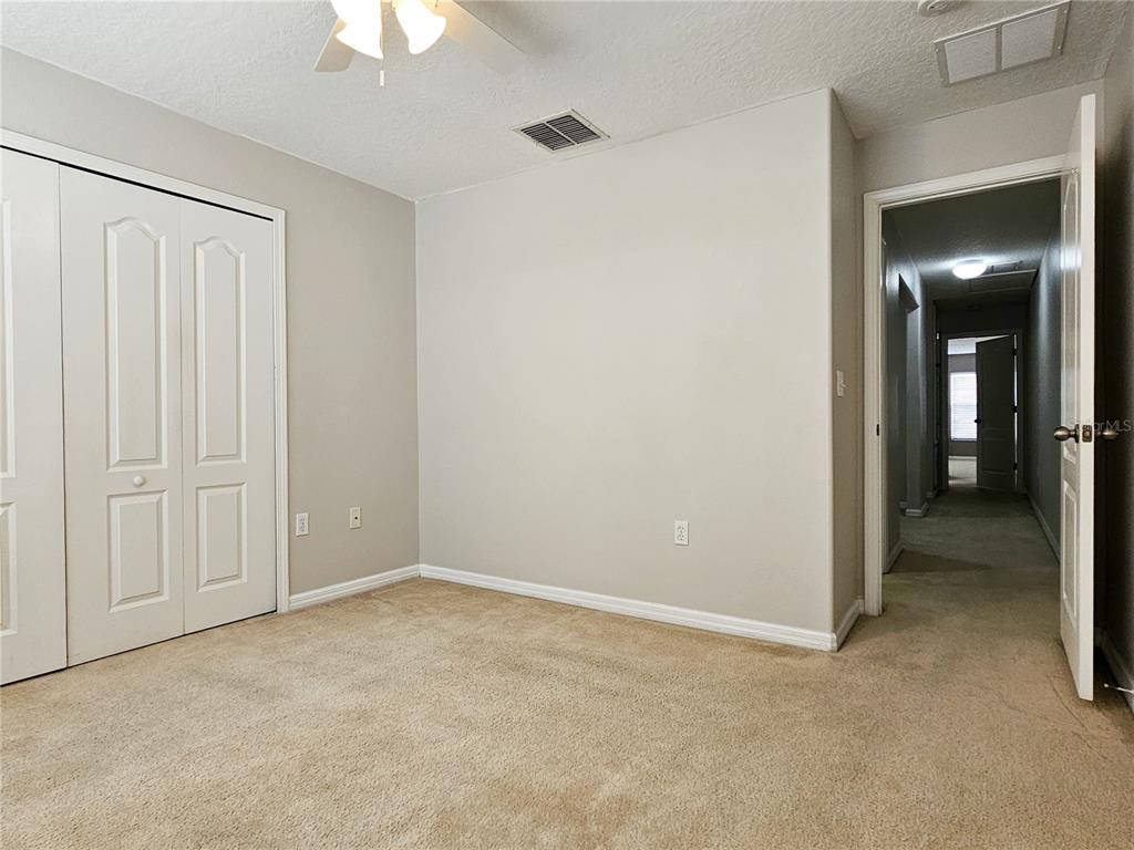 5383 Quarry Rock Road Lakeland, FL 33809 - Photo 19 of 23 a view of an empty room and chandelier fan