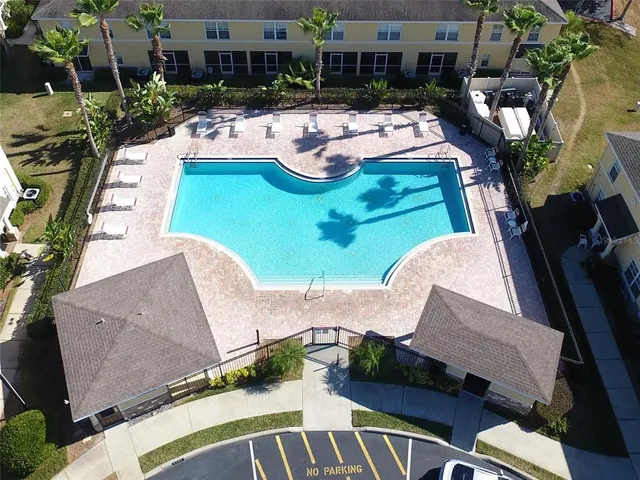 an aerial view of a house with outdoor space