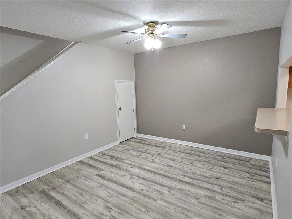 5383 Quarry Rock Road Lakeland, FL 33809 - Photo 10 of 23 a view of an empty room with a chandelier fan
