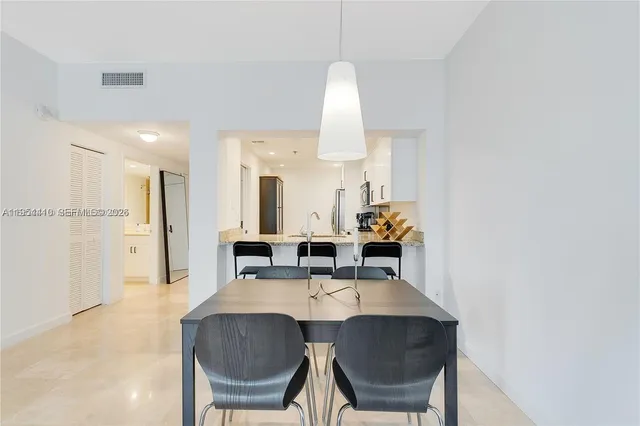 a kitchen with a sink cabinets and microwave