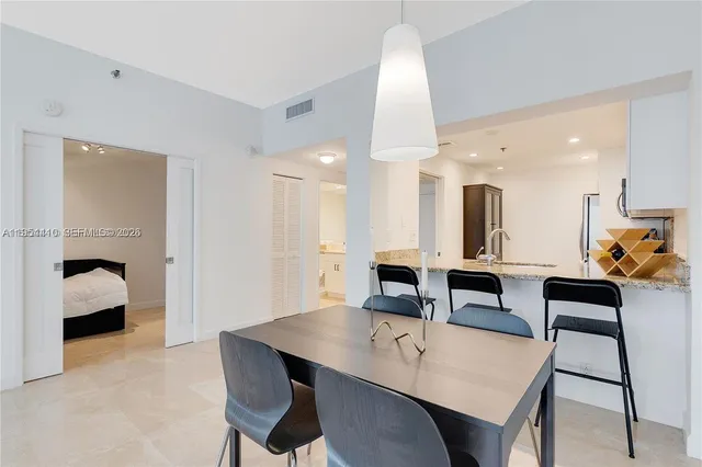 a bathroom with a double vanity sink toilet and shower