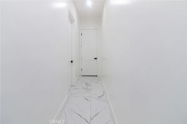 a view of hallway with closet