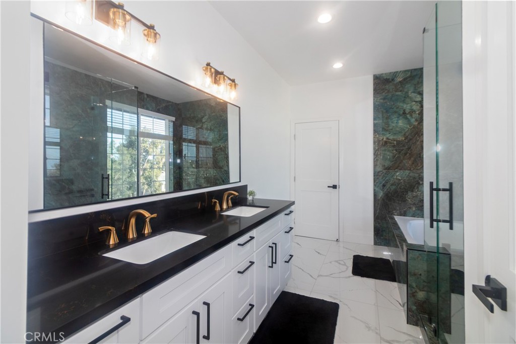 17423 Wicker Way Riverside, CA 92504 - Photo 25 of 66 a close view of sink and mirror