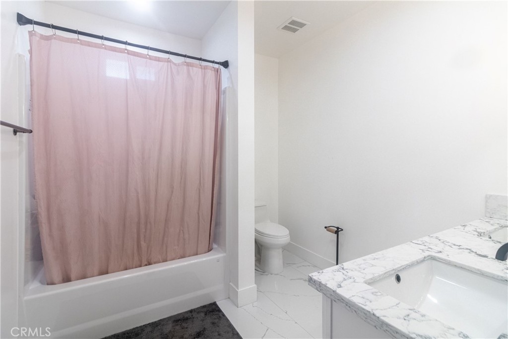 17423 Wicker Way Riverside, CA 92504 - Photo 30 of 66 a bathroom with a sink and a toilet