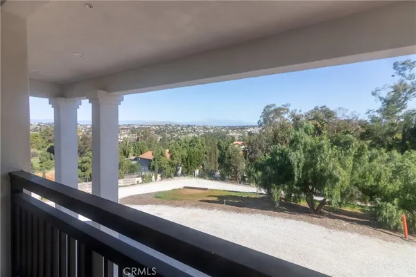 a view of a backyard with sitting area