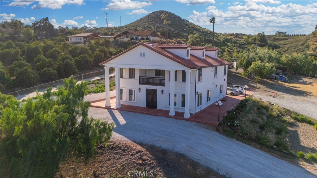 17423 Wicker Way Riverside, CA 92504 - Photo 59 of 66 a front view of a house with a yard