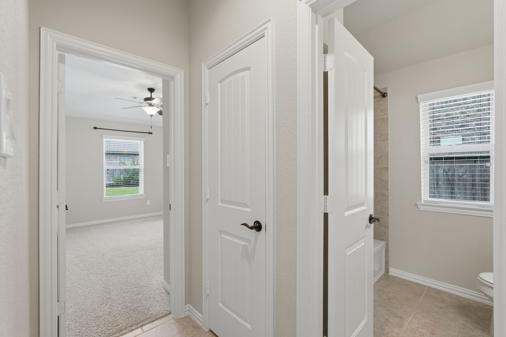 18227 Tacoma Ridge Drive Tomball, TX 77377 - Photo 31 of 45 Convenient hallway connecting the bedrooms, bath, and nearby storage closet.