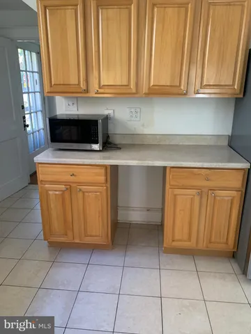 a kitchen with a cabinets and appliances