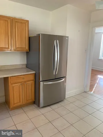 a kitchen with cabinets and stainless steel appliances