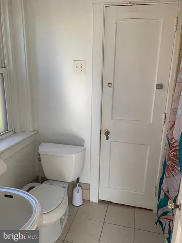a bathroom with a toilet and a sink