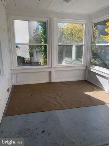 a view of lot of kitchen with furniture and window